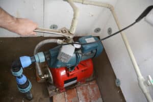 Contractor installing water pump